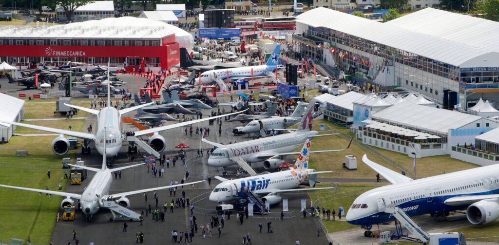 Planes and people outside at Farnborough International Airshow